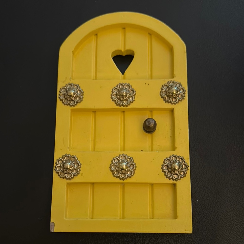 Yellow Decorative Wall Hanging with Heart Cutout